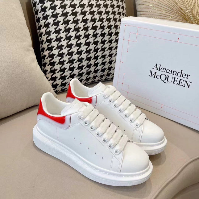 OVERSIZED SNEAKER IN WHITE CALFSKIN WITH GLOSSY RED AND WHITE HEEL TAB