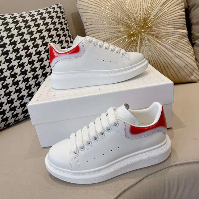 OVERSIZED SNEAKER IN WHITE CALFSKIN WITH GLOSSY RED AND WHITE HEEL TAB