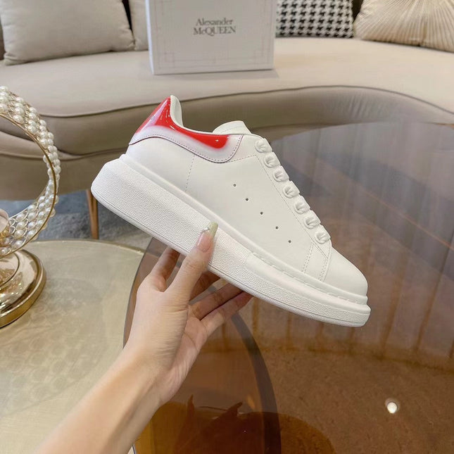 OVERSIZED SNEAKER IN WHITE CALFSKIN WITH GLOSSY RED AND WHITE HEEL TAB