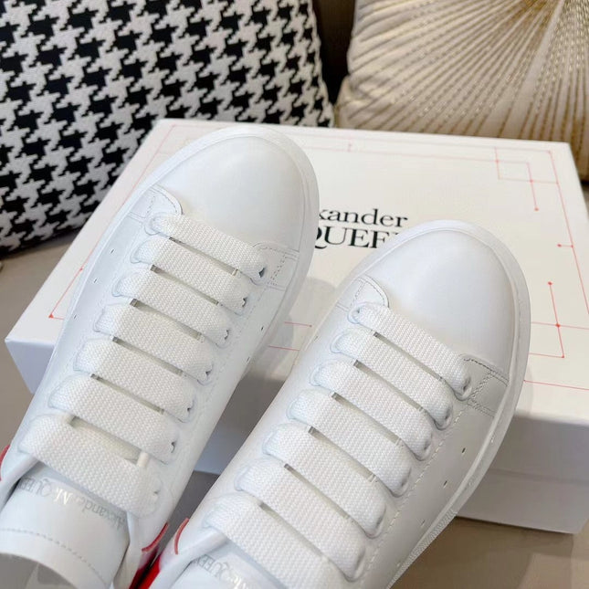 OVERSIZED SNEAKER IN WHITE CALFSKIN WITH GLOSSY RED AND WHITE HEEL TAB