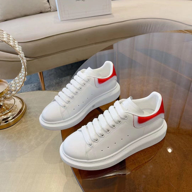 OVERSIZED SNEAKER IN WHITE CALFSKIN WITH GLOSSY RED AND WHITE HEEL TAB
