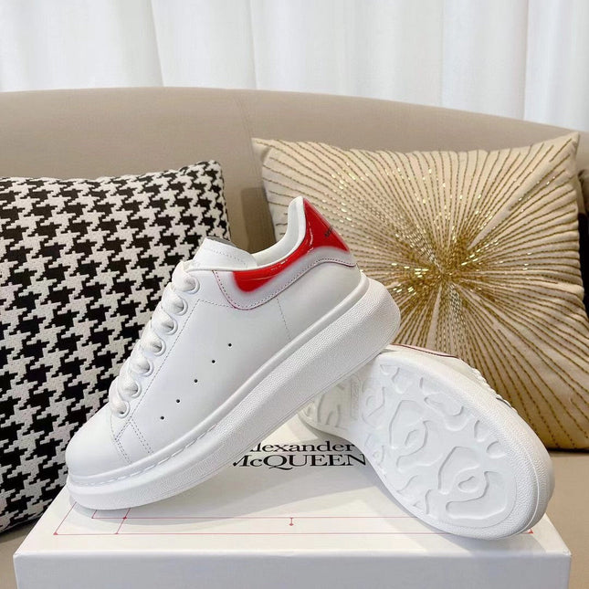 OVERSIZED SNEAKER IN WHITE CALFSKIN WITH GLOSSY RED AND WHITE HEEL TAB
