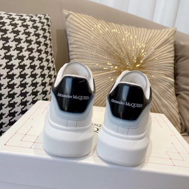 OVERSIZED SNEAKER IN WHITE CALFSKIN WITH GLOSSY BLACK AND WHITE HEEL TAB