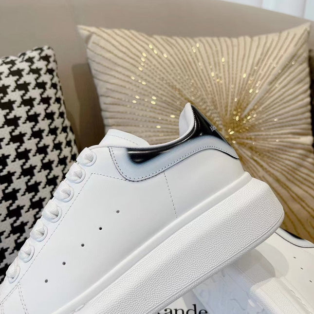 OVERSIZED SNEAKER IN WHITE CALFSKIN WITH GLOSSY BLACK AND WHITE HEEL TAB