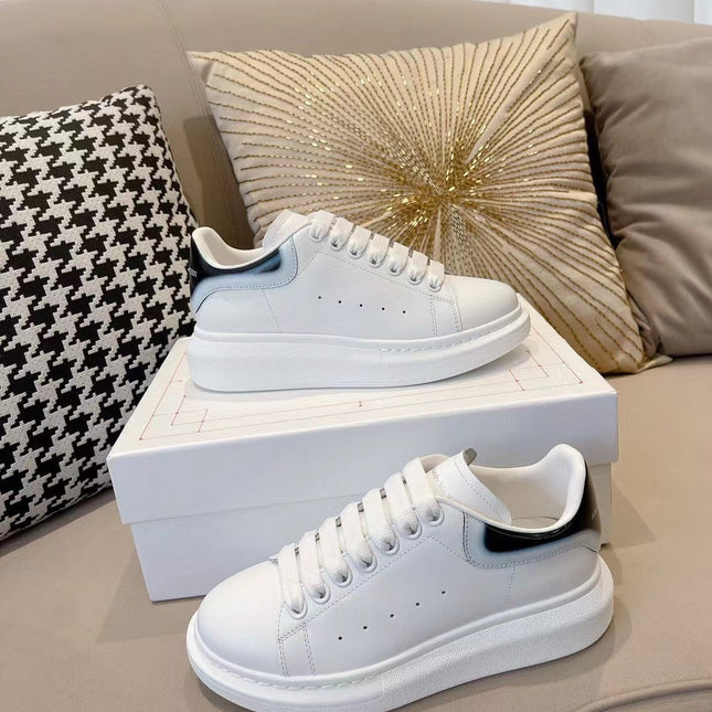 OVERSIZED SNEAKER IN WHITE CALFSKIN WITH GLOSSY BLACK AND WHITE HEEL TAB