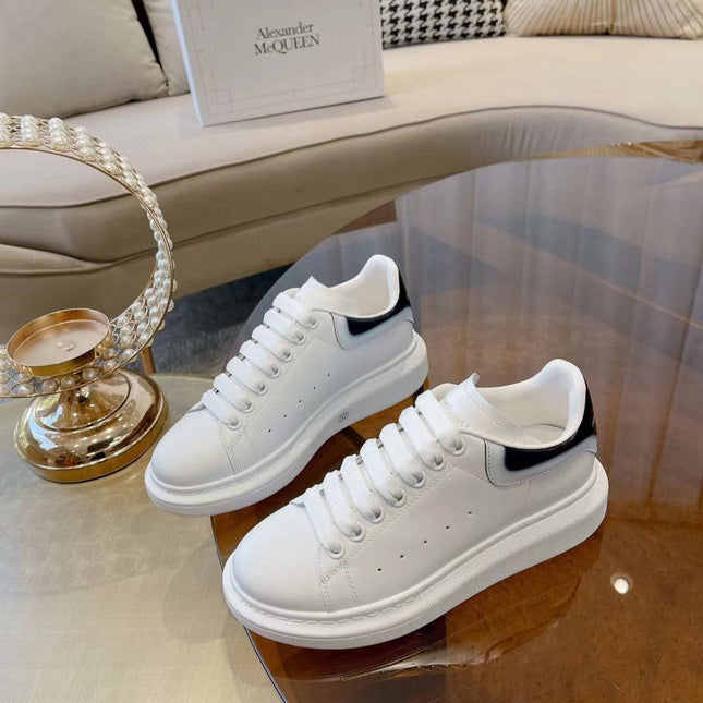 OVERSIZED SNEAKER IN WHITE CALFSKIN WITH GLOSSY BLACK AND WHITE HEEL TAB