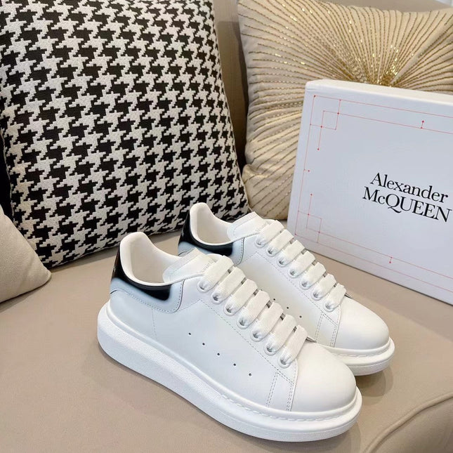 OVERSIZED SNEAKER IN WHITE CALFSKIN WITH GLOSSY BLACK AND WHITE HEEL TAB
