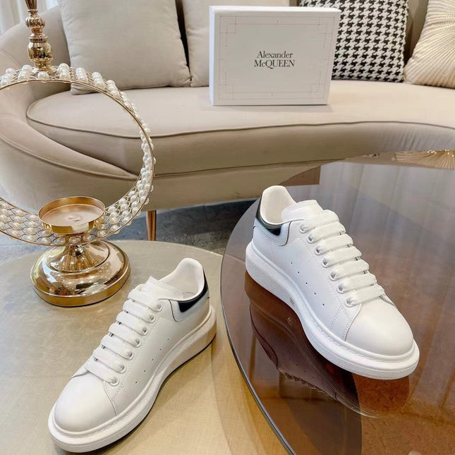 OVERSIZED SNEAKER IN WHITE CALFSKIN WITH GLOSSY BLACK AND WHITE HEEL TAB