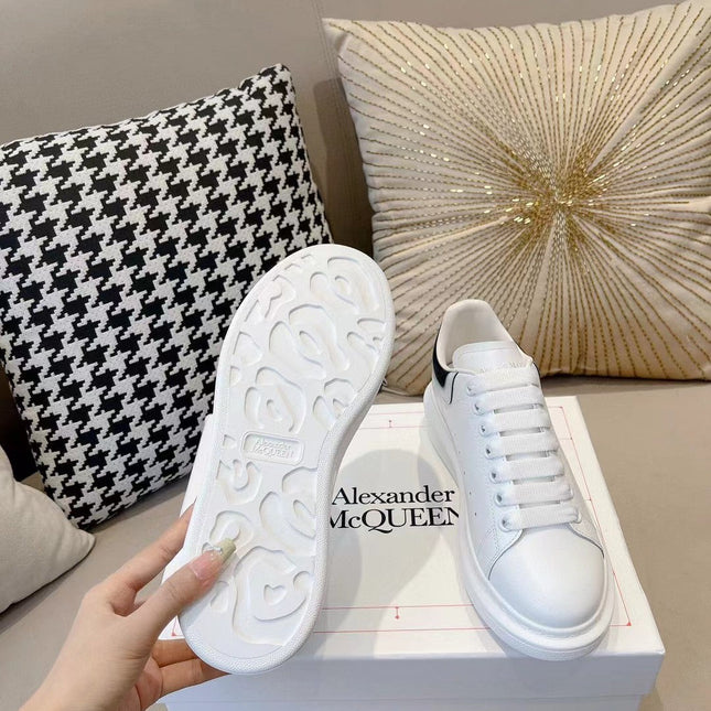 OVERSIZED SNEAKER IN WHITE CALFSKIN WITH GLOSSY BLACK AND WHITE HEEL TAB