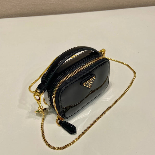 MINI HAND BAG 11 WITH GOLD STRAP IN BLACK PATENT CALFSKIN