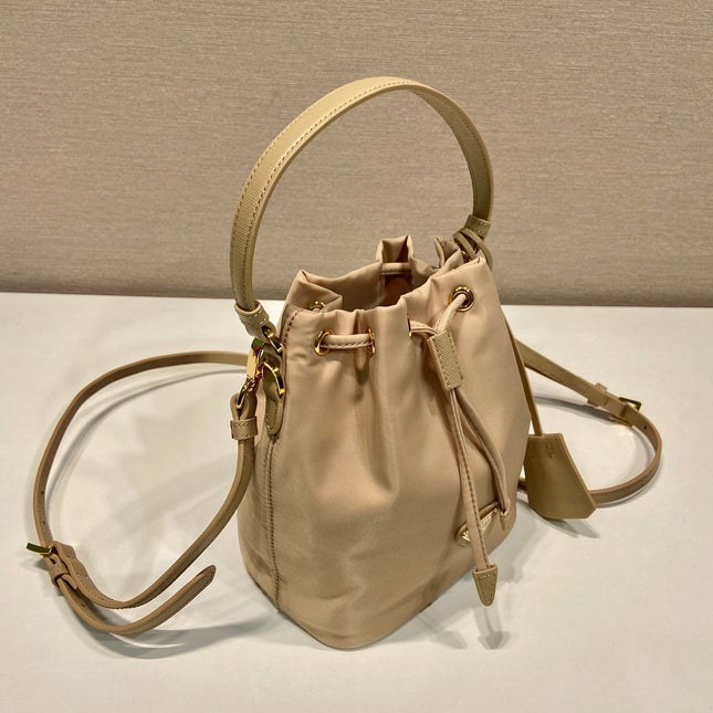 BUCKET BAG 19 IN BEIGE RE-NYLON AND SAFFIANO LEATHER HANDLE