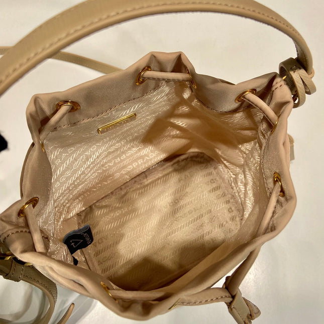 BUCKET BAG 19 IN BEIGE RE-NYLON AND SAFFIANO LEATHER HANDLE