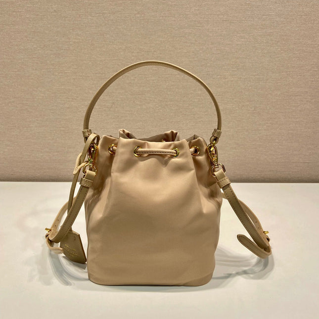BUCKET BAG 19 IN BEIGE RE-NYLON AND SAFFIANO LEATHER HANDLE