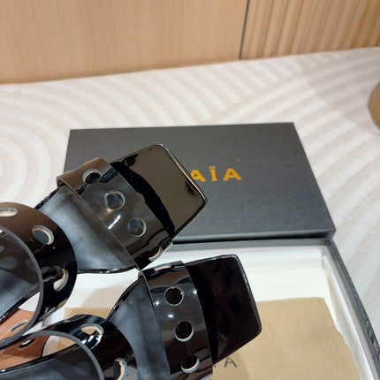 ALAIA TWO-STRAPS HIGH HEEL SANDALS IN BLACK PATENT LAMBSKIN