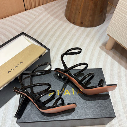 ALAIA THREE-STRAPS HIGH HEEL SANDALS IN BLACK PATENT LAMBSKIN