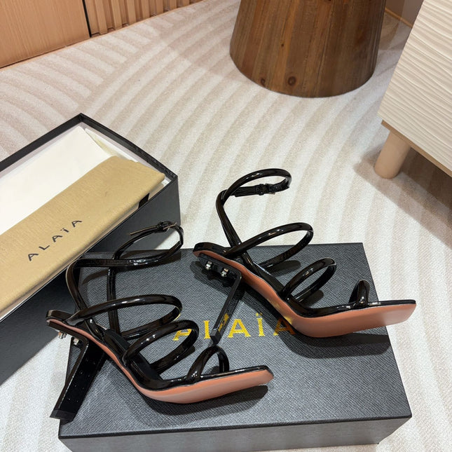 ALAIA THREE-STRAPS HIGH HEEL SANDALS IN BLACK PATENT LAMBSKIN