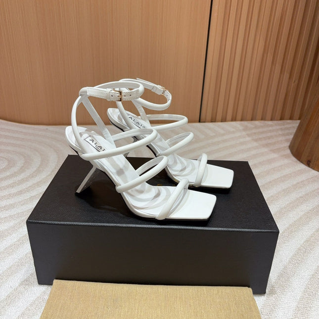 ALAIA THREE-STRAPS HIGH HEEL SANDALS IN WHITE PATENT LAMBSKIN