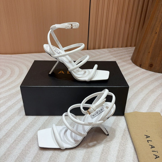ALAIA THREE-STRAPS HIGH HEEL SANDALS IN WHITE PATENT LAMBSKIN