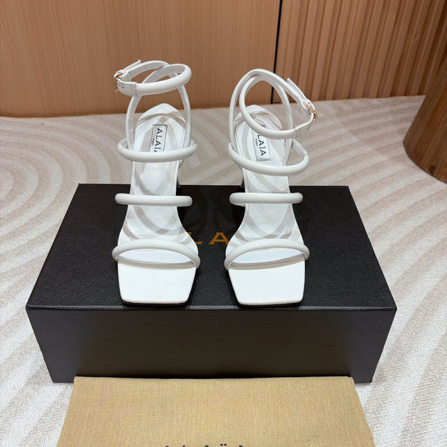 ALAIA THREE-STRAPS HIGH HEEL SANDALS IN WHITE PATENT LAMBSKIN