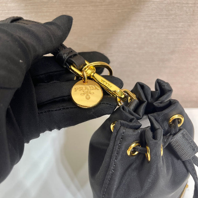 MINI BUCKET BAG 10 IN BLACK RE-NYLON AND SAFFIANO LEATHER STRAP