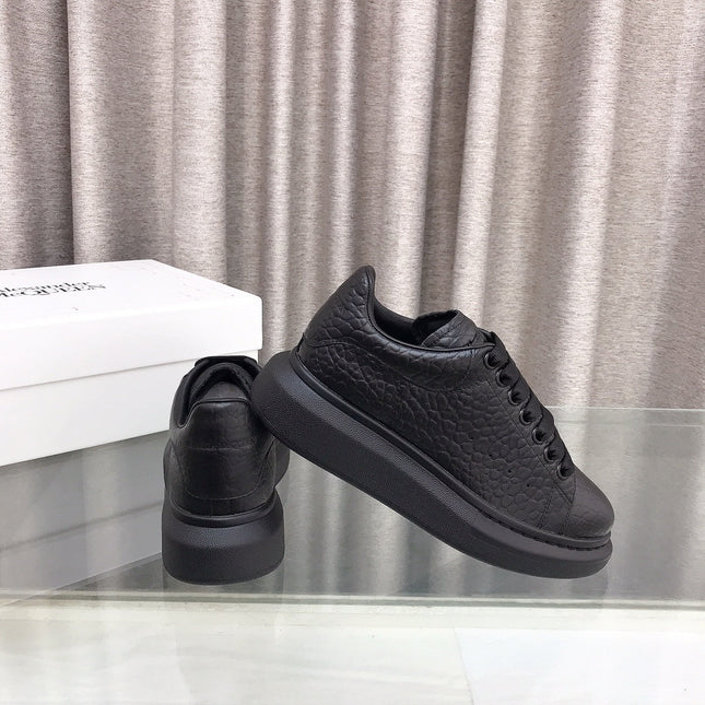 OVERSIZED SNEAKERS IN BLACK TEXTURED CALFSKIN EMBOSSED LOGO