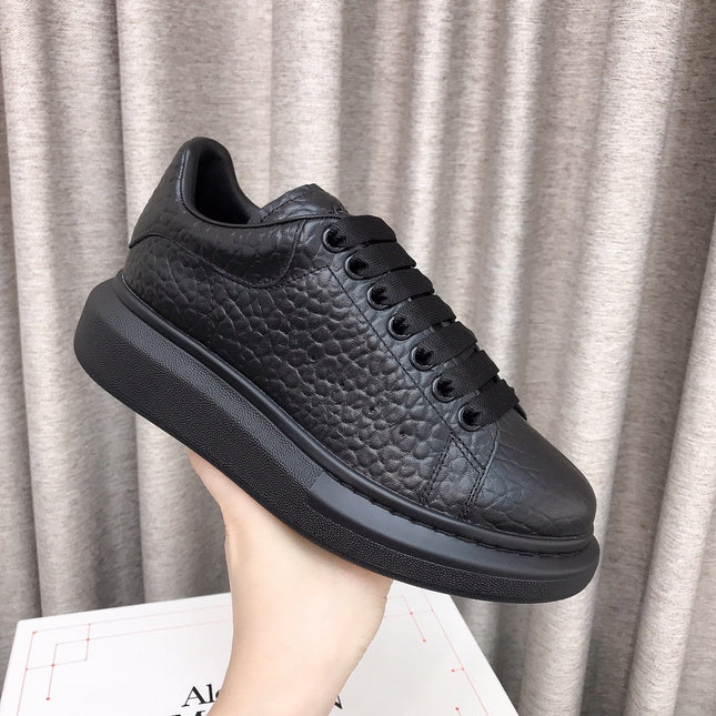 OVERSIZED SNEAKERS IN BLACK TEXTURED CALFSKIN EMBOSSED LOGO