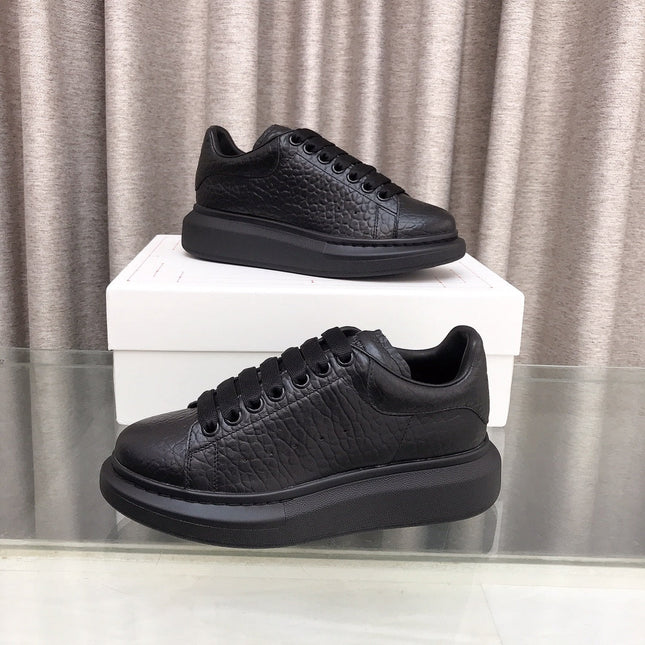 OVERSIZED SNEAKERS IN BLACK TEXTURED CALFSKIN EMBOSSED LOGO