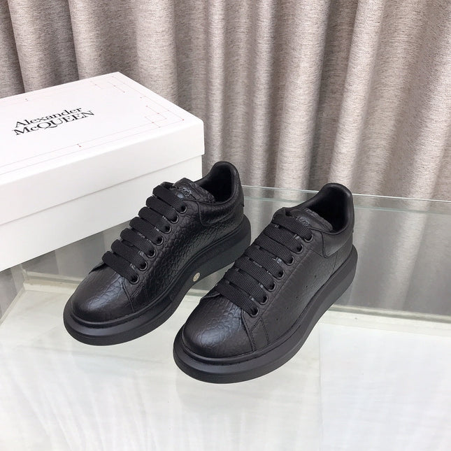 OVERSIZED SNEAKERS IN BLACK TEXTURED CALFSKIN EMBOSSED LOGO