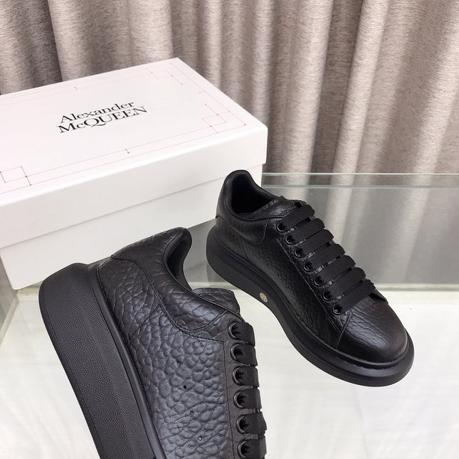 OVERSIZED SNEAKERS IN BLACK TEXTURED CALFSKIN EMBOSSED LOGO