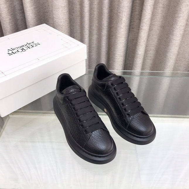 OVERSIZED SNEAKERS IN BLACK TEXTURED CALFSKIN EMBOSSED LOGO