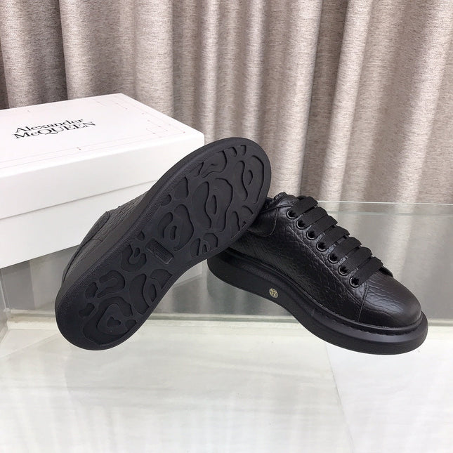 OVERSIZED SNEAKERS IN BLACK TEXTURED CALFSKIN EMBOSSED LOGO
