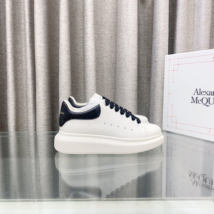 OVERSIZED SNEAKERS IN WHITE CALFSKIN WITH BLACK HEEL TAB