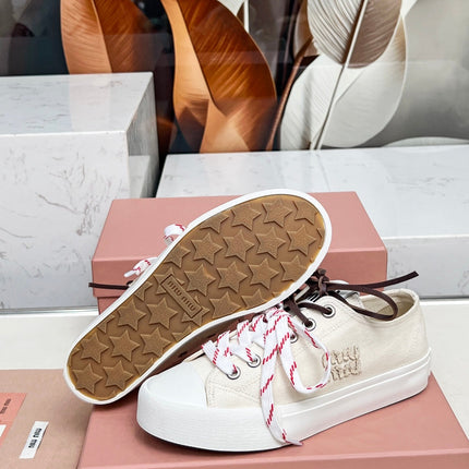 WASHED-DENIM SNEAKERS IN OFF WHITE CANVAS WITH BROWN AND STRIPED LACES