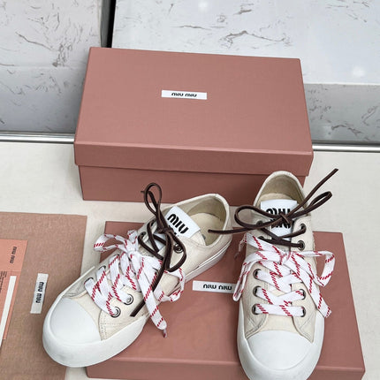 WASHED-DENIM SNEAKERS IN OFF WHITE CANVAS WITH BROWN AND STRIPED LACES