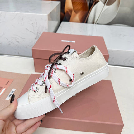 WASHED-DENIM SNEAKERS IN OFF WHITE CANVAS WITH BROWN AND STRIPED LACES