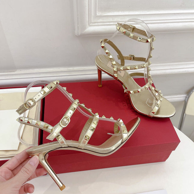 ROCKSTUD 100 GOLD METALLIC CALFSKIN ANKLE STRAP HIGH SANDAL