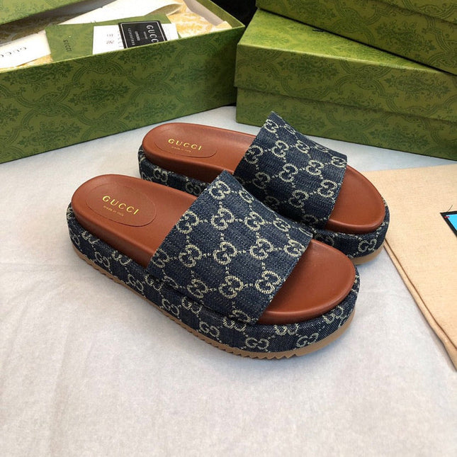 GG THICK PLATFORM SLIDES IN BLUE MONOGRAM EMBOSSED FABRIC