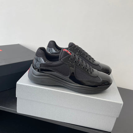 PRADA SNEAKER 25S IN BLACK MESH AND PATENT CALFSKIN
