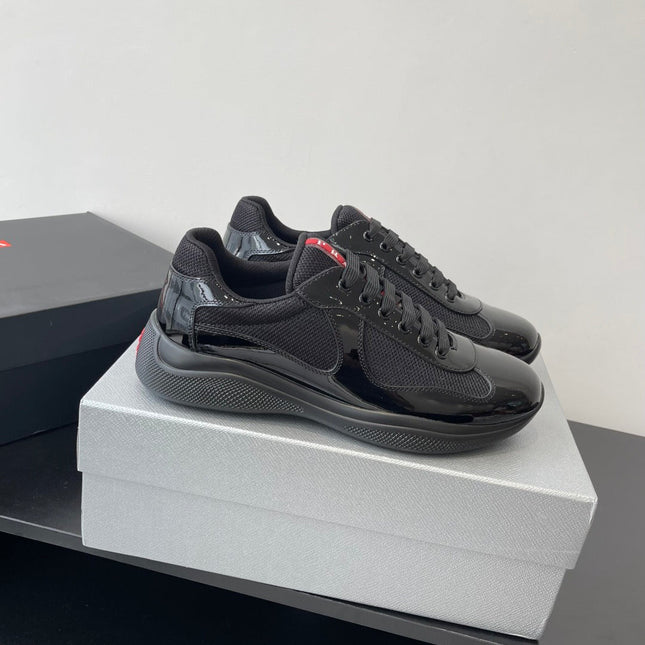PRADA SNEAKER 25S IN BLACK MESH AND PATENT CALFSKIN