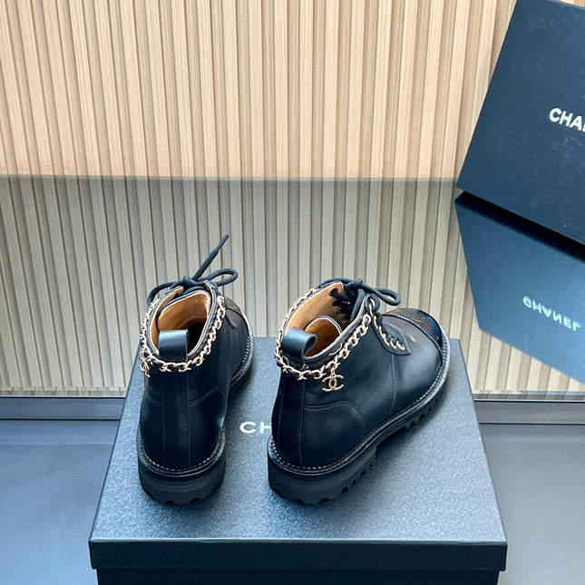 CHANEL 25S MARTIN LACE-UP BOOTS WITH CHAIN DETAIL IN BLACK CALFSKIN
