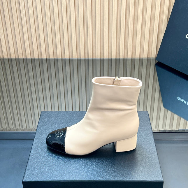 CHANEL 25S BOOTS WITH PATENT TOE CAP 50MM IN BEIGE AND BLACK CALFSKIN