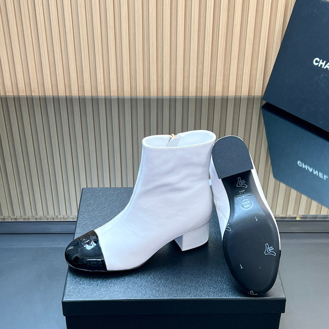 CHANEL 25S BOOTS WITH PATENT TOE CAP 50MM IN WHITE AND BLACK CALFSKIN