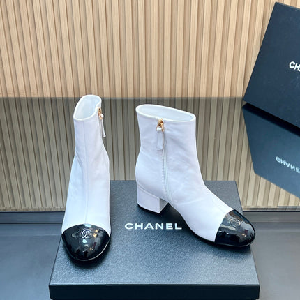 CHANEL 25S BOOTS WITH PATENT TOE CAP 50MM IN WHITE AND BLACK CALFSKIN