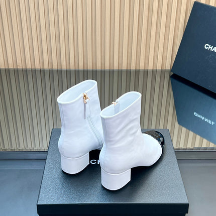 CHANEL 25S BOOTS WITH PATENT TOE CAP 50MM IN WHITE AND BLACK CALFSKIN