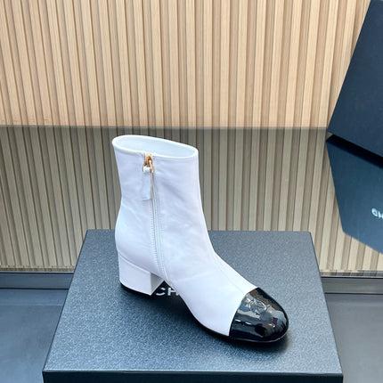 CHANEL 25S BOOTS WITH PATENT TOE CAP 50MM IN WHITE AND BLACK CALFSKIN