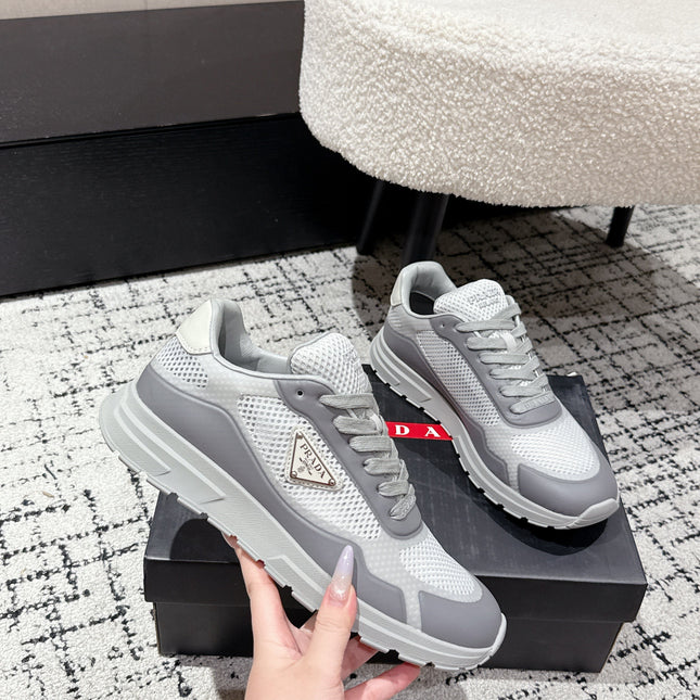 PRADA 25S MEN SNEAKERS IN GRAY AND WHITE CANVAS