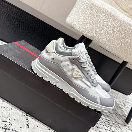 PRADA 25S MEN SNEAKERS IN GRAY AND WHITE CANVAS