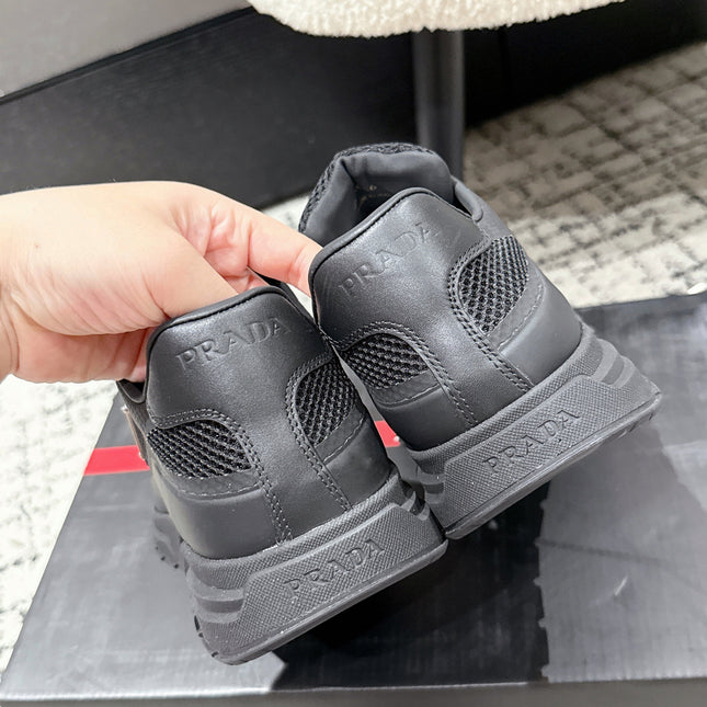 PRADA 25S MEN SNEAKERS IN BLACK CANVAS