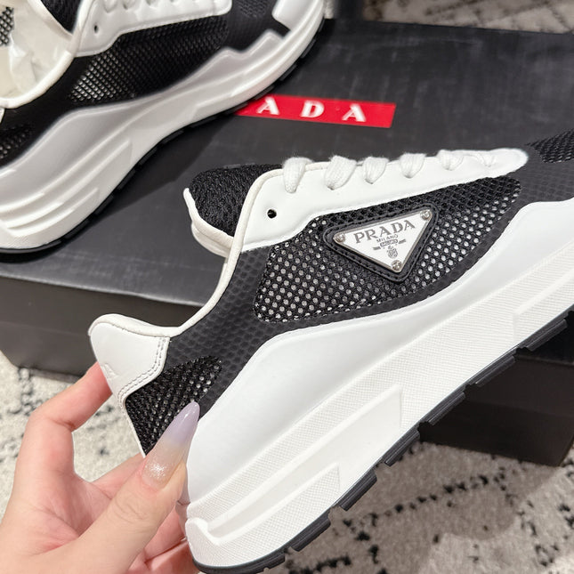 PRADA 25S MEN SNEAKERS IN BLACK AND WHITE CANVAS