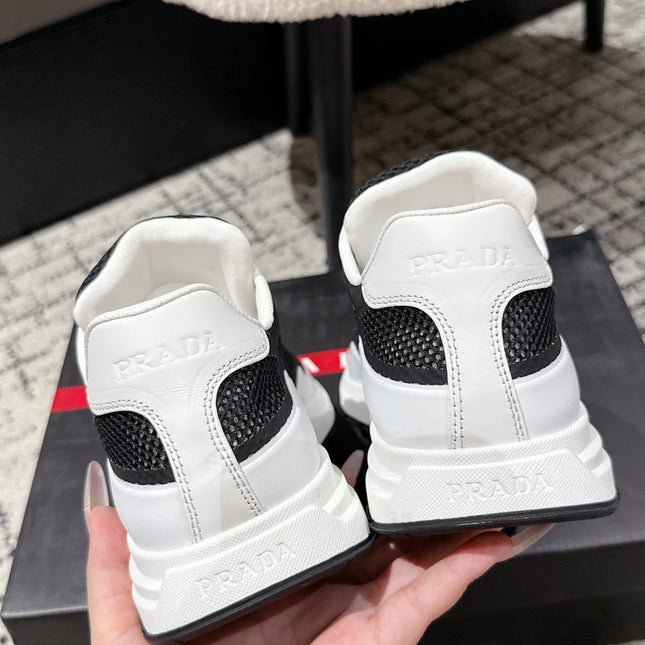 PRADA 25S MEN SNEAKERS IN BLACK AND WHITE CANVAS